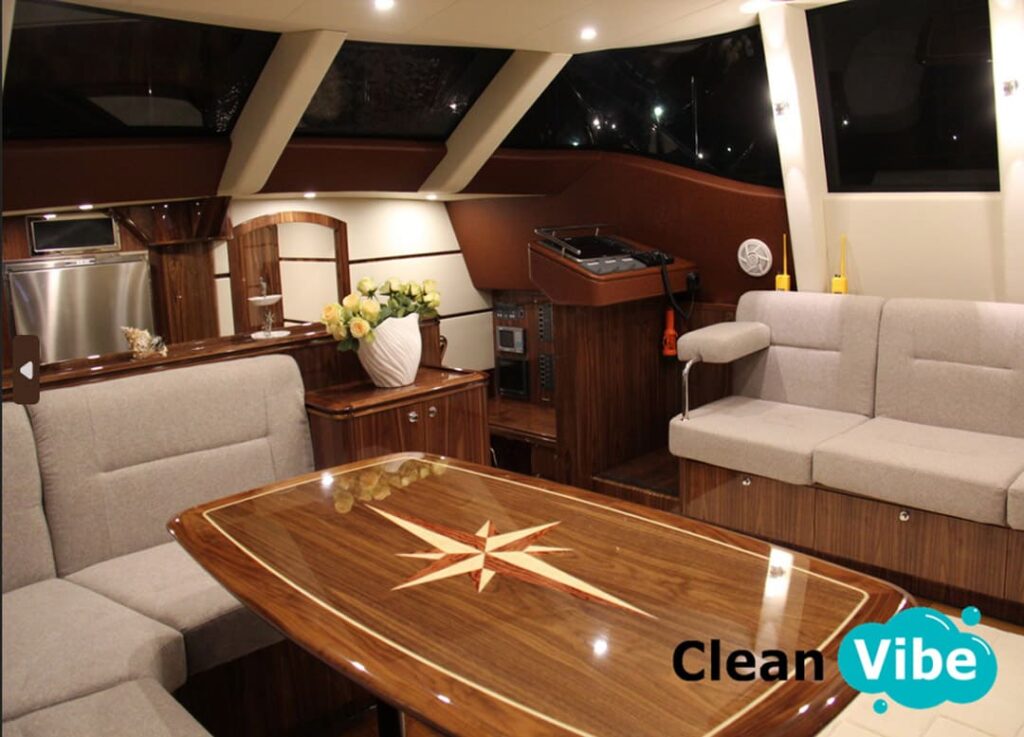 Elegant yacht salon with wooden table