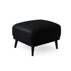 Cleaned leather ottoman in a living room setting
